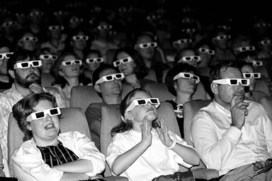 an_audience_watches_a_film_through_3d_glasses